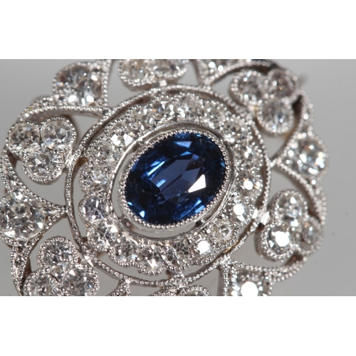102 - Antique gold, diamond and sapphire oval shaped brooch, the central sapphire surrounded by a halo of ... 