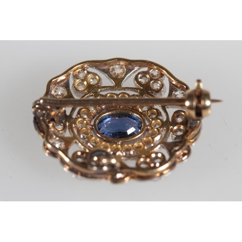 102 - Antique gold, diamond and sapphire oval shaped brooch, the central sapphire surrounded by a halo of ... 