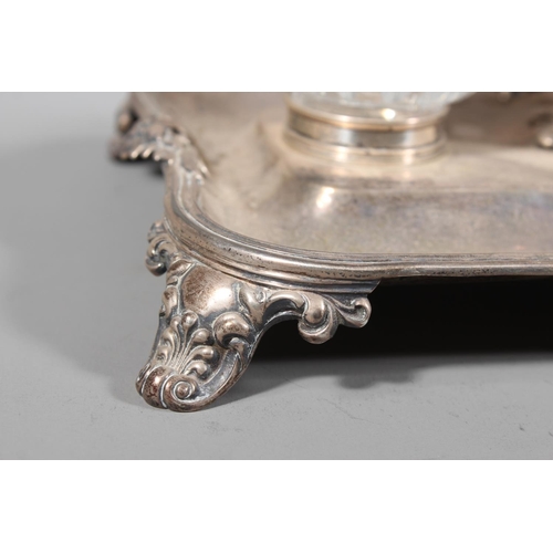 25 - William IV silver desk stand with twin glass inkwells raised on scrolling feet, Charles Reily & ... 