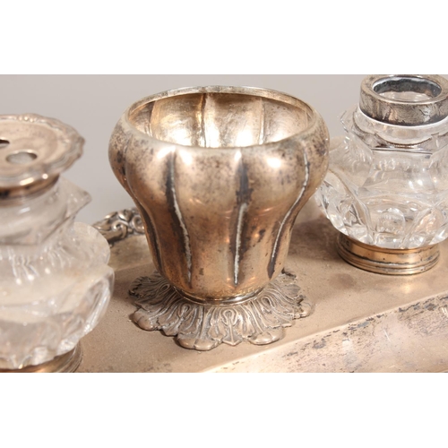 25 - William IV silver desk stand with twin glass inkwells raised on scrolling feet, Charles Reily & ... 