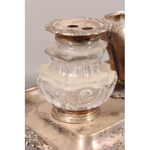 25 - William IV silver desk stand with twin glass inkwells raised on scrolling feet, Charles Reily & ... 