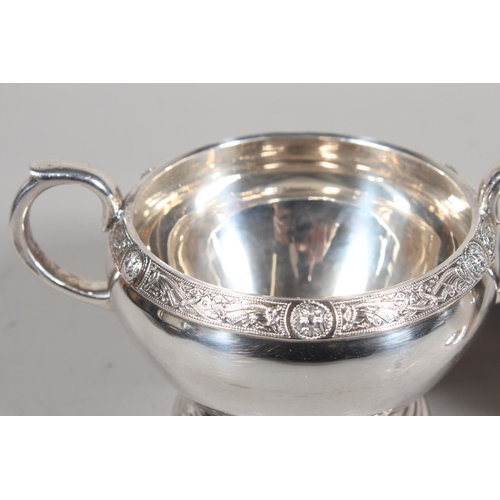 27 - Four piece silver tea service on matching tray, with Lindisfarne border decoration and stamp to base... 