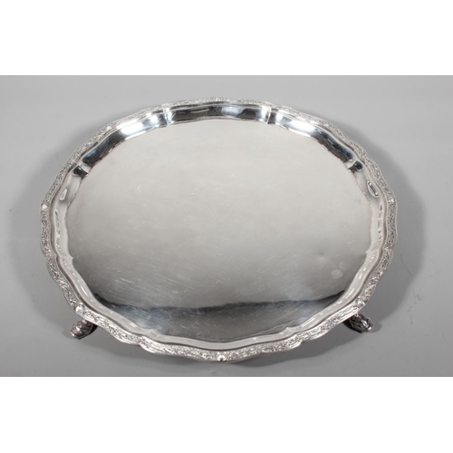 27 - Four piece silver tea service on matching tray, with Lindisfarne border decoration and stamp to base... 