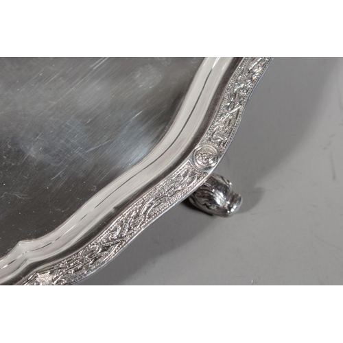 27 - Four piece silver tea service on matching tray, with Lindisfarne border decoration and stamp to base... 