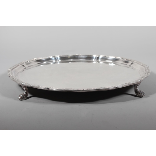 27 - Four piece silver tea service on matching tray, with Lindisfarne border decoration and stamp to base... 
