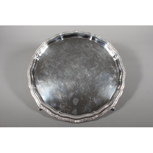 27 - Four piece silver tea service on matching tray, with Lindisfarne border decoration and stamp to base... 