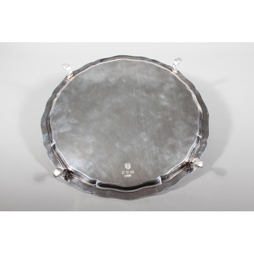 27 - Four piece silver tea service on matching tray, with Lindisfarne border decoration and stamp to base... 