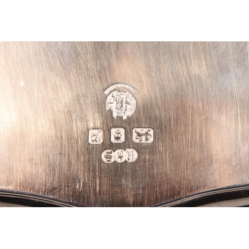 27 - Four piece silver tea service on matching tray, with Lindisfarne border decoration and stamp to base... 