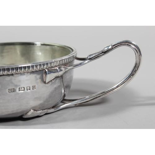 29 - Sterling silver porringer with single loop handle, beaded edge border and glass liner, Guild of Hand... 