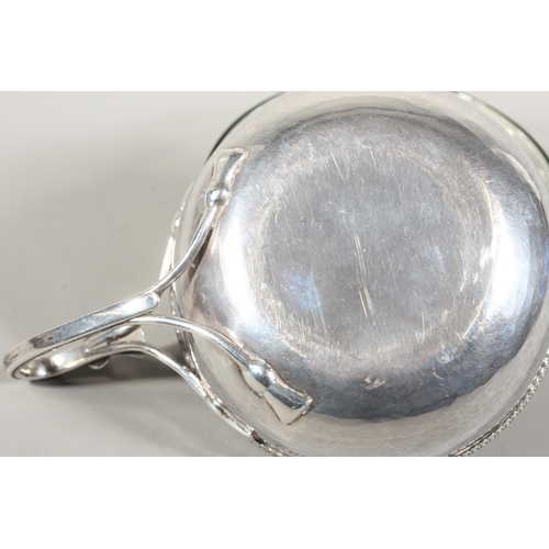 29 - Sterling silver porringer with single loop handle, beaded edge border and glass liner, Guild of Hand... 