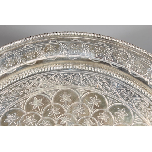 6 - Victorian silver salver with heavy foliate decoration and raised on tripod feet,&nbsp;Hamilton, Cric... 