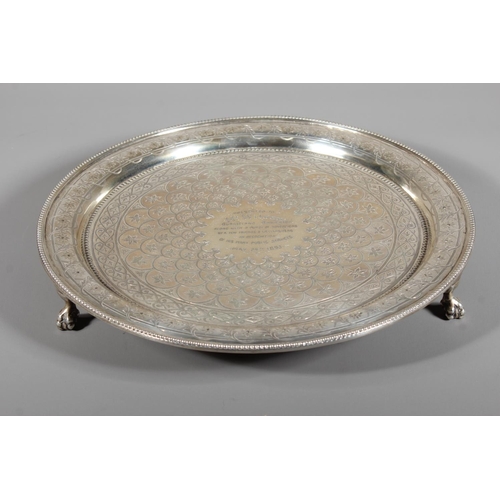 6 - Victorian silver salver with heavy foliate decoration and raised on tripod feet,&nbsp;Hamilton, Cric... 
