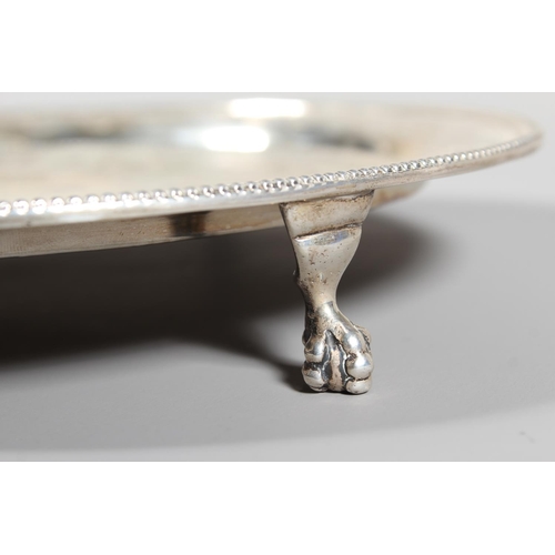 6 - Victorian silver salver with heavy foliate decoration and raised on tripod feet,&nbsp;Hamilton, Cric... 