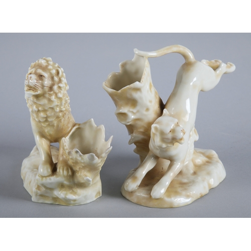 23 - Staffordshire style lion posey vases, both approx 11cm h.