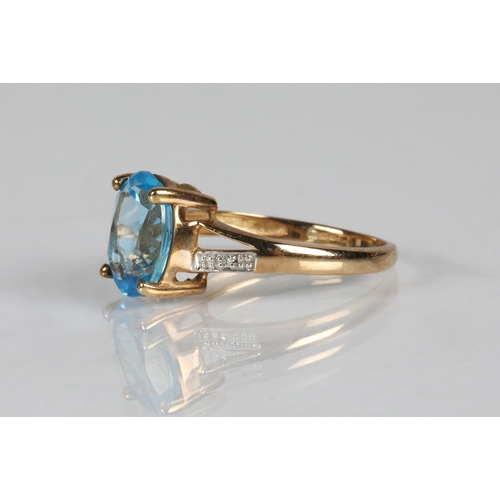 53A - 9ct gold ring set with a blue topaz, ring size N, 2.2g
