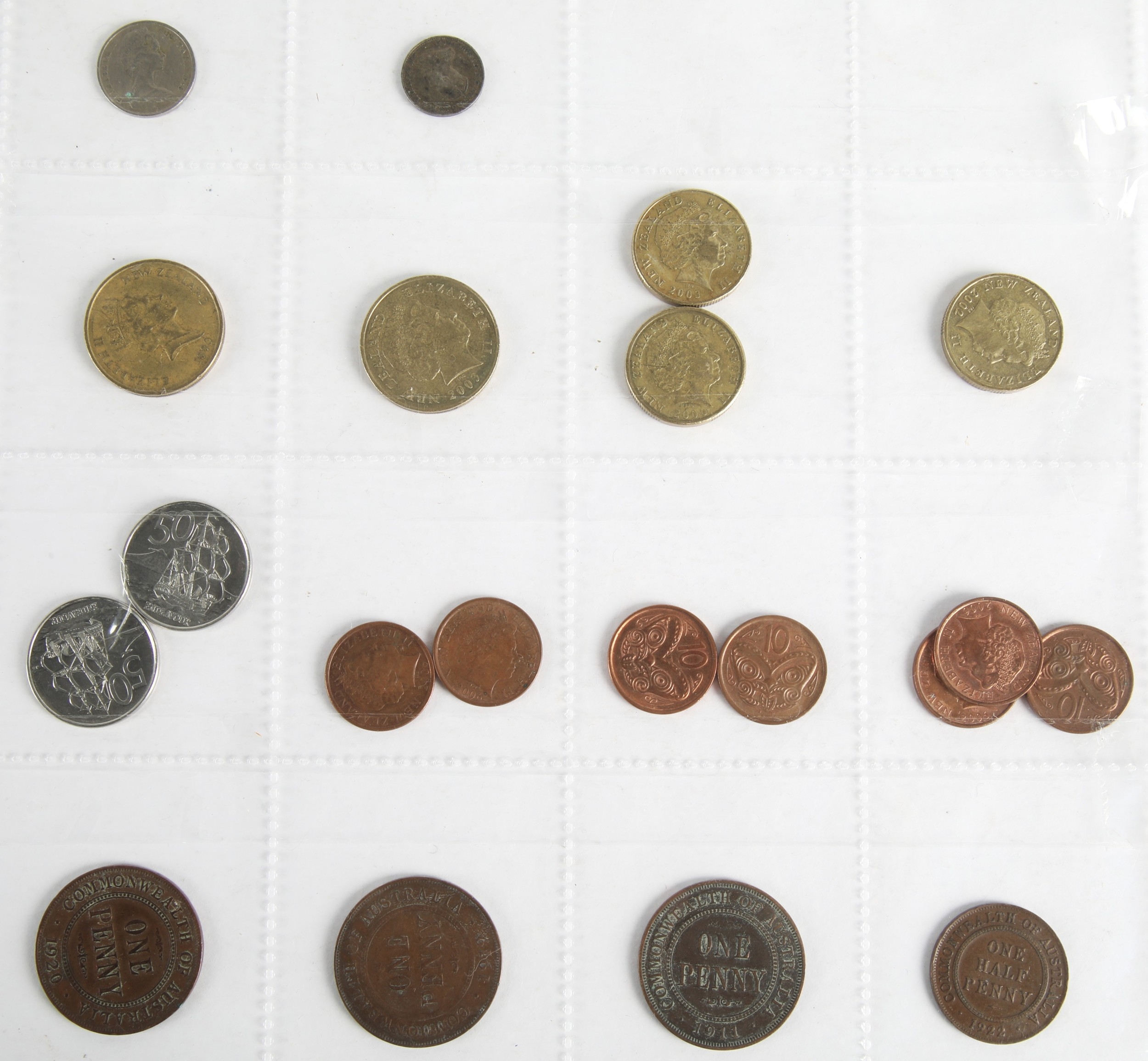 Five sheets of coins and tokens to include UK, Canada, Australia, and ...