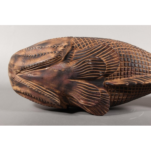 1 - Heavily carved wooden fish model....