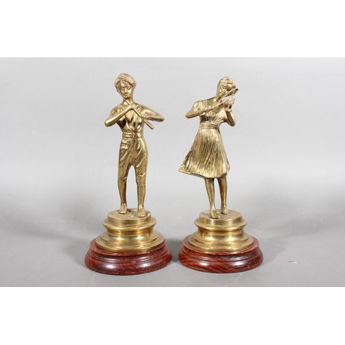 100 - Pair of brass musical figures on hardwood stands.