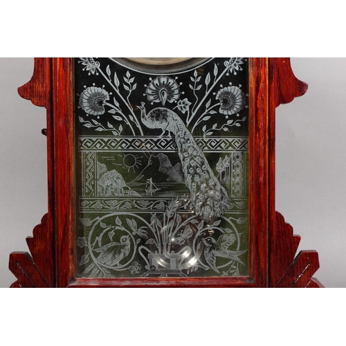 102 - Ansonia clock with Roman numeral chapter ring and carved wood case.