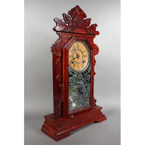 102 - Ansonia clock with Roman numeral chapter ring and carved wood case.
