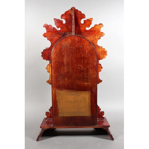 102 - Ansonia clock with Roman numeral chapter ring and carved wood case.