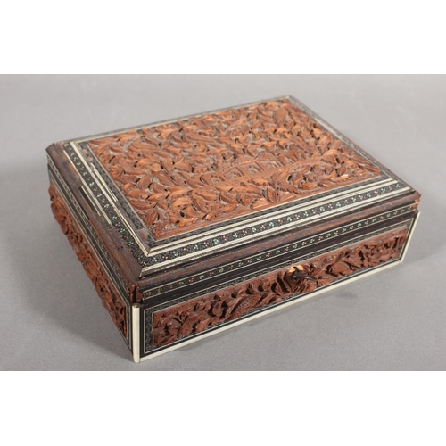 105 - Heavily carved wooden box with inlay.