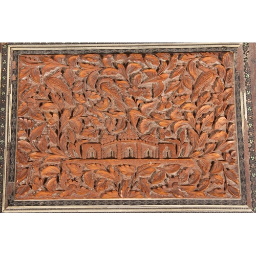 105 - Heavily carved wooden box with inlay.