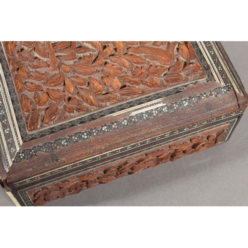 105 - Heavily carved wooden box with inlay.