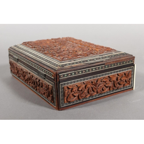 105 - Heavily carved wooden box with inlay.