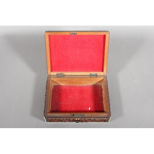 105 - Heavily carved wooden box with inlay.