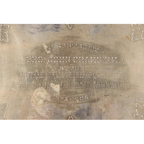 12 - Silver-plated twin-handled scroll and foliate decorated tray with pierced gallery....