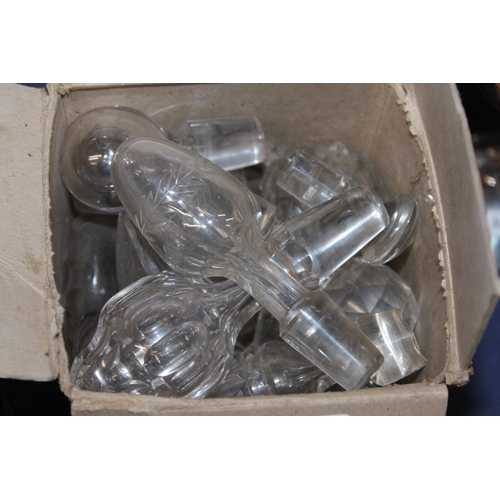 14 - Glass stoppers, a pair of cut-glass decanters and four green glass drinking glasses....