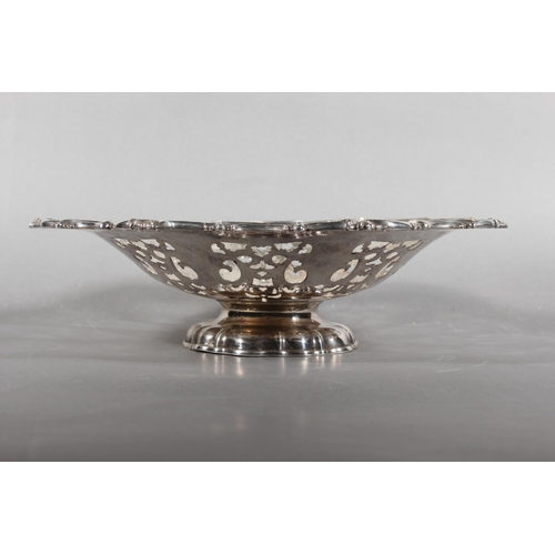 16 - Silver-plated centrepiece with pierced body and scrolling border....