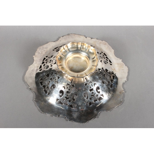 16 - Silver-plated centrepiece with pierced body and scrolling border....