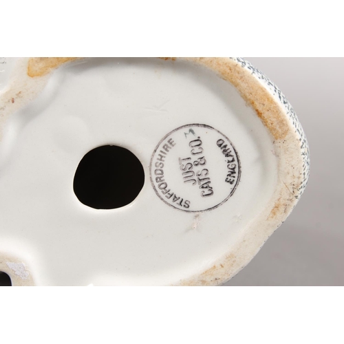 4 - Two Winstanley cat models and a Staffordshire cat model....