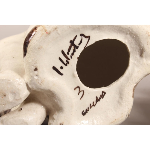 4 - Two Winstanley cat models and a Staffordshire cat model....