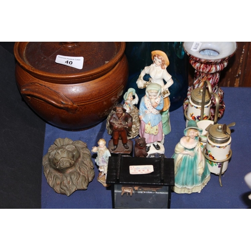 40 - Twin-handled pot and cover, ceramic figures, a Black Forest style condiment set on stand, a lionhead...