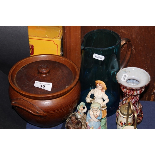 40 - Twin-handled pot and cover, ceramic figures, a Black Forest style condiment set on stand, a lionhead...