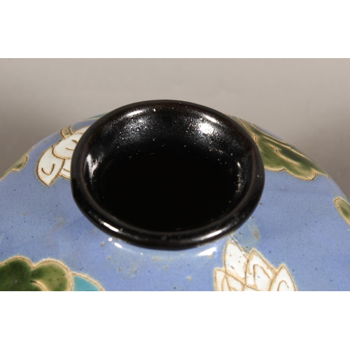 42 - Studio Pottery vase with floral decoration and blue ground....