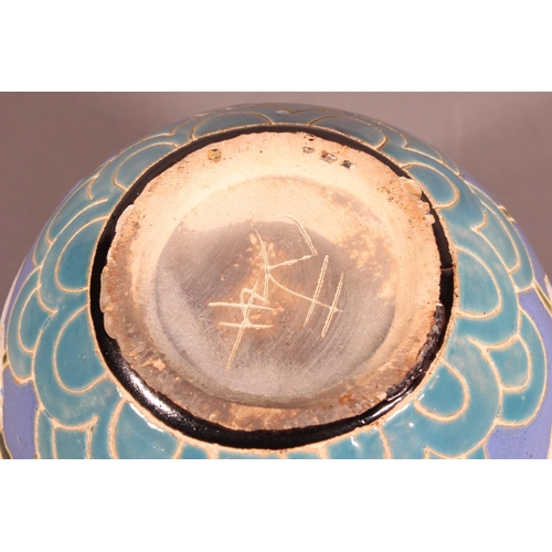 42 - Studio Pottery vase with floral decoration and blue ground....