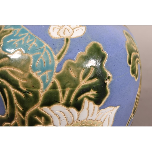 42 - Studio Pottery vase with floral decoration and blue ground....