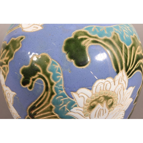 42 - Studio Pottery vase with floral decoration and blue ground....