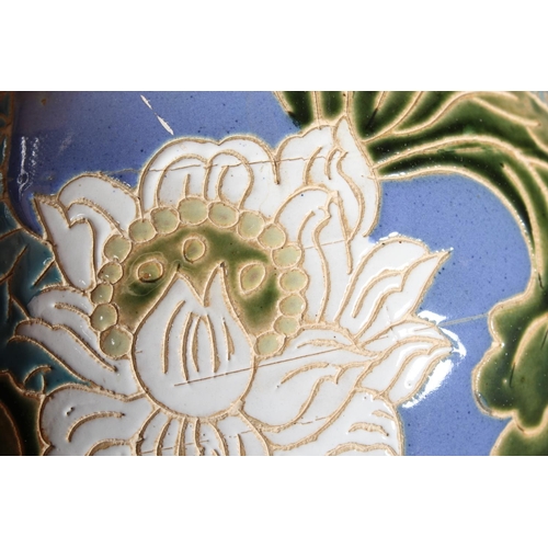 42 - Studio Pottery vase with floral decoration and blue ground....