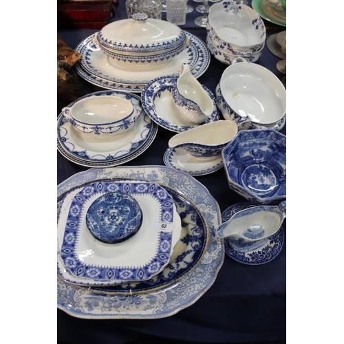 62 - Blue and white ceramics to include an ashet, tureens, side dishes, sauceboats, an hexagonal bowl, et... 