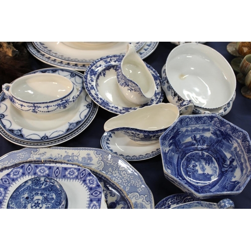 62 - Blue and white ceramics to include an ashet, tureens, side dishes, sauceboats, an hexagonal bowl, et... 