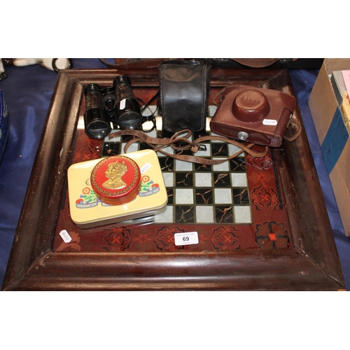 69 - Two cased cameras, a pair of French binoculars, commemorative tins and a chessboard.