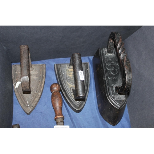 74 - Seven flat irons and a flat iron stand to include Swain, and others.