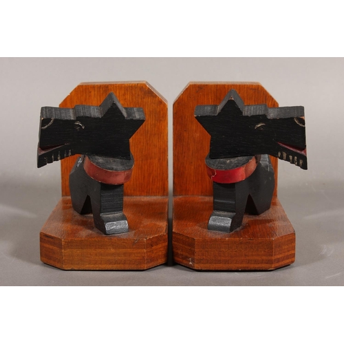 77 - Art Deco style wooden bookends with black Scottie Dog mounts.