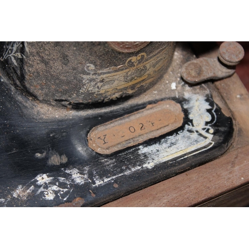81 - Cased Singer sewing machine and another