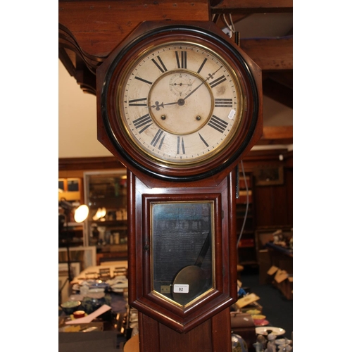 82 - Antique Ansonia clock in mahogany case with Roman numeral chapter ring and second subsidiary dial.